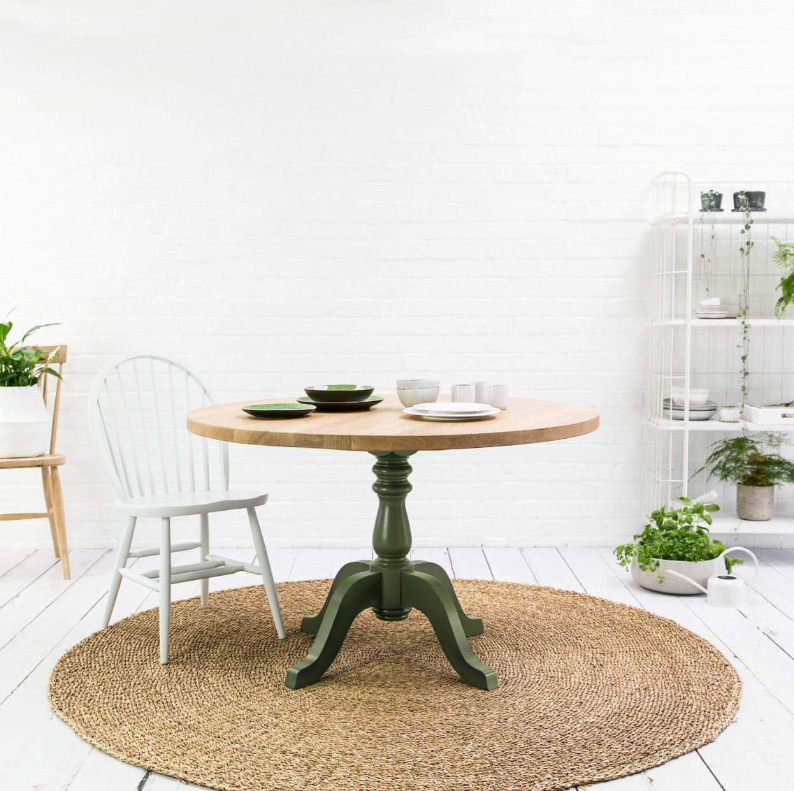 Round dining table with green frame