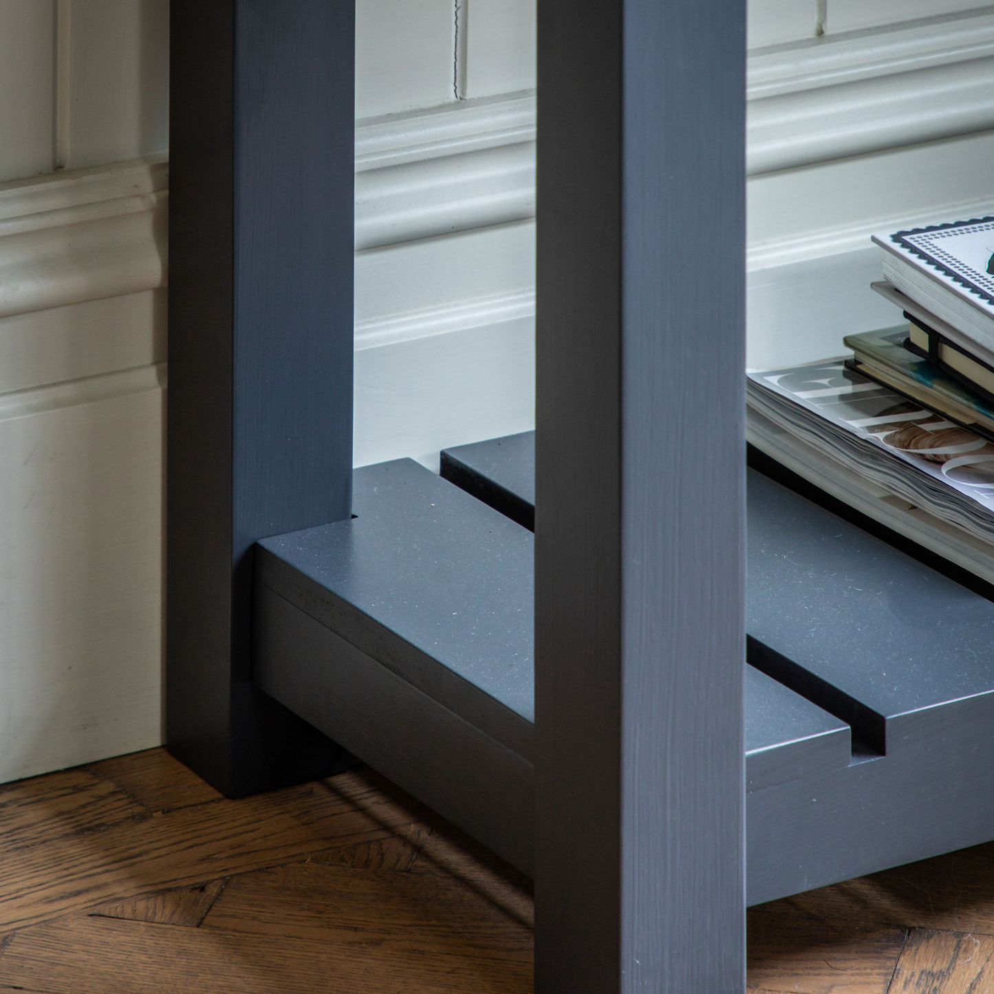A Buckland Console Table from Kikiathome.co.uk with magazines on it, perfect for home furniture and interior decor.