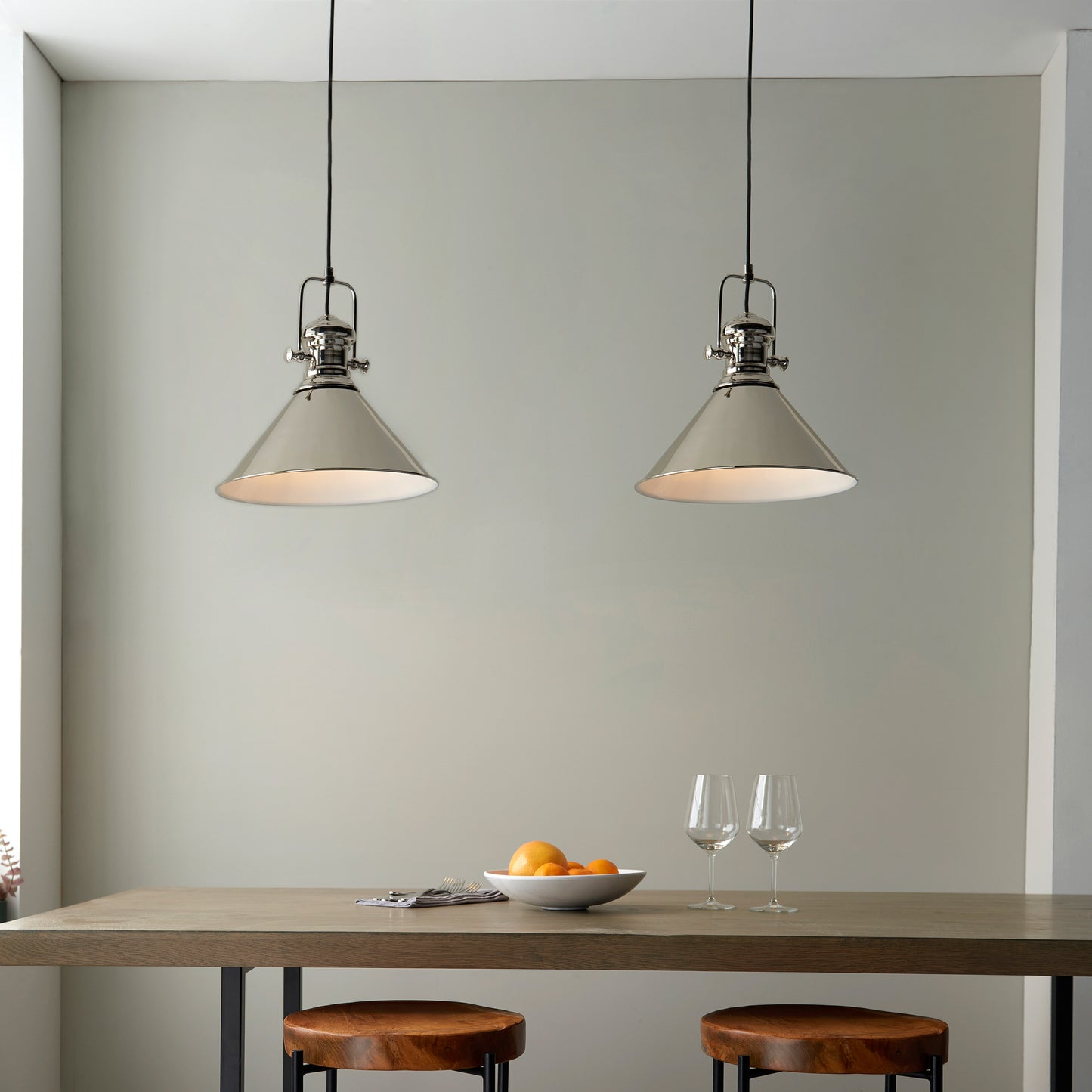 Two Brampton 1 Pendant Lights hanging over a table in a kitchen, enhancing the interior decor of the home from Kikiathome.co.uk.