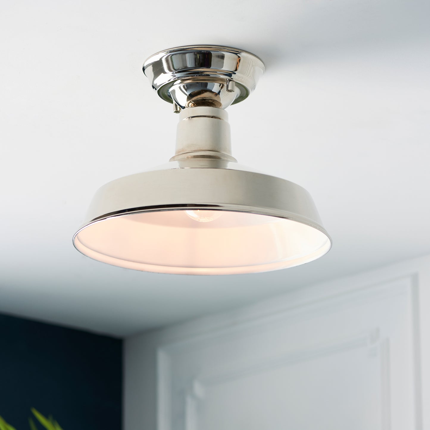 An interior decor featuring the Darton 1 Ceiling Light with a plant on it offered by Kikiathome.co.uk.