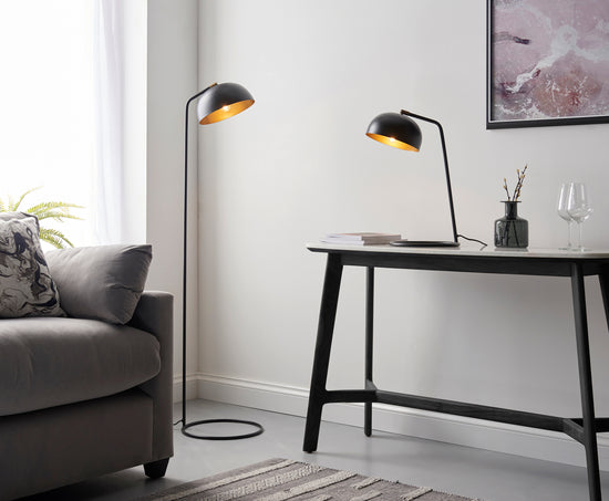 A living room with a Diptford 1 Table Light Matt Black lamp and home furniture.
