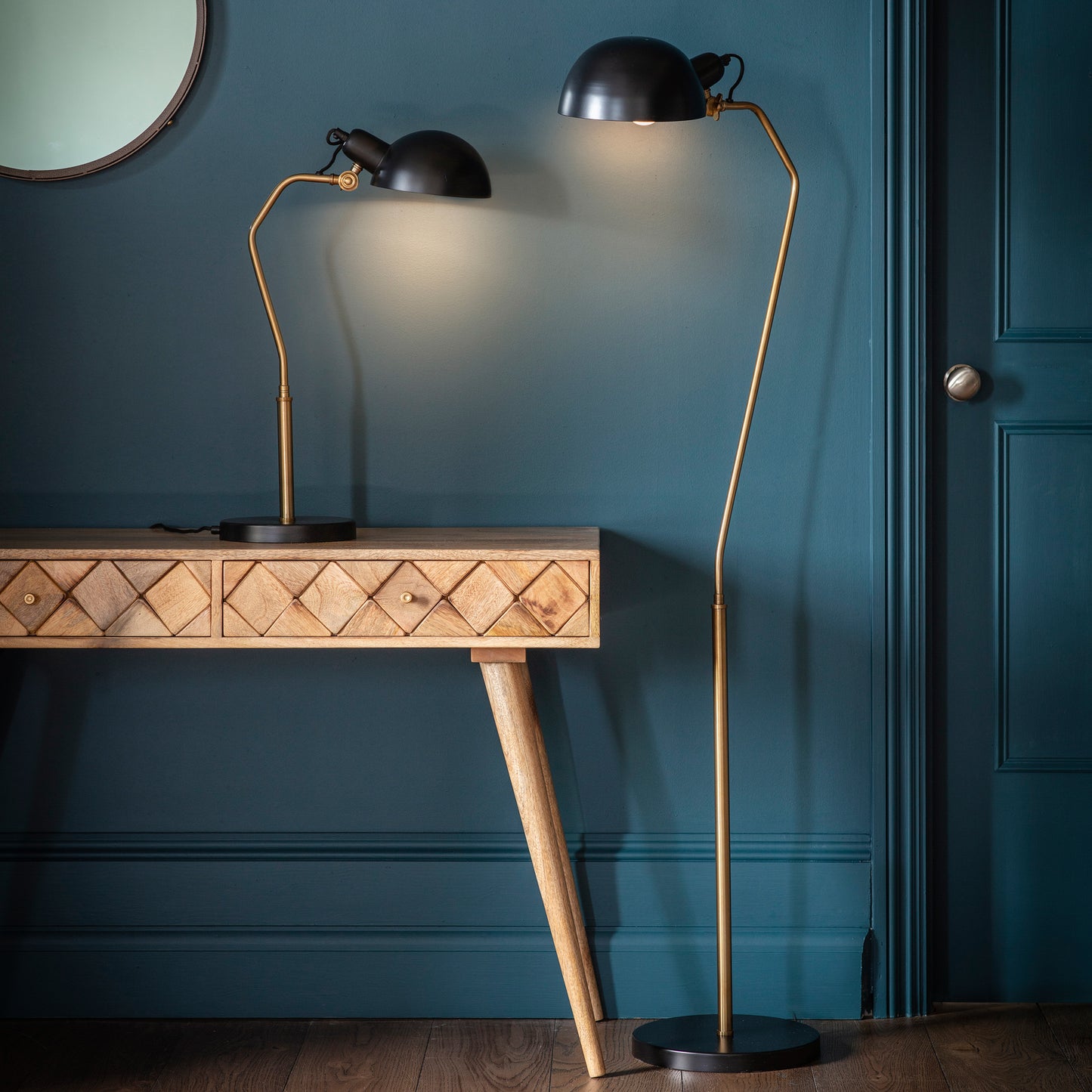 A Lisk Floor Lamp and a table in a room with blue walls, showcasing home furniture from Kikiathome.co.uk.