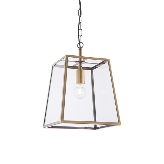 An antique brass pendant light with a clear glass shade for interior decor.