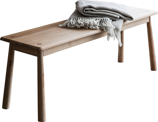 A home furniture bench with blanket from Kikiathome.co.uk.