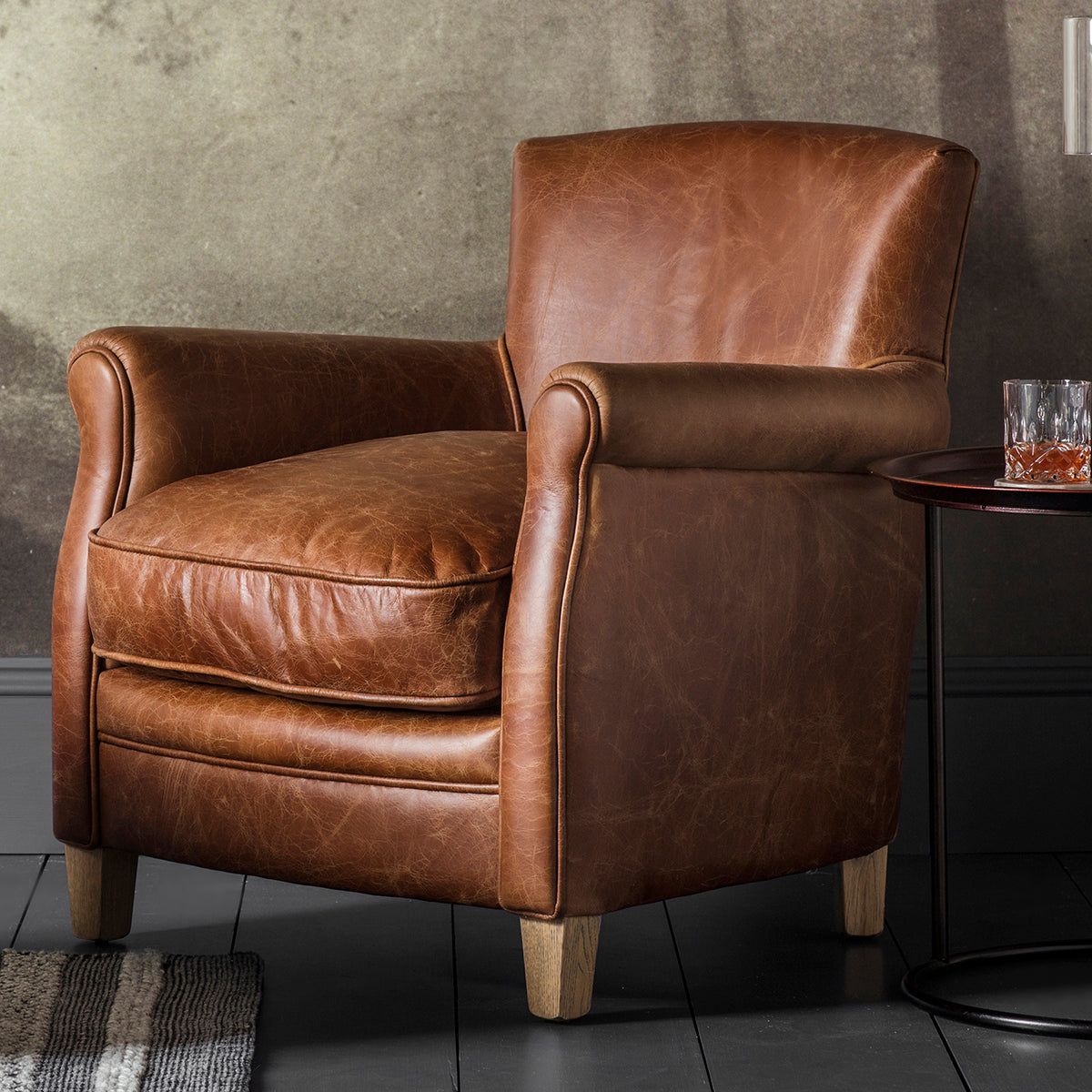 A vintage brown leather club chair for home furniture and interior decor from Kikiathome.co.uk.