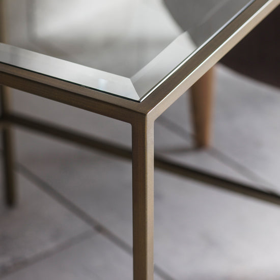 A close up of the Engleborne Side Table Bronze 500x500x550mm with brass legs from Kikiathome.co.uk, perfect for interior decor and home furniture.