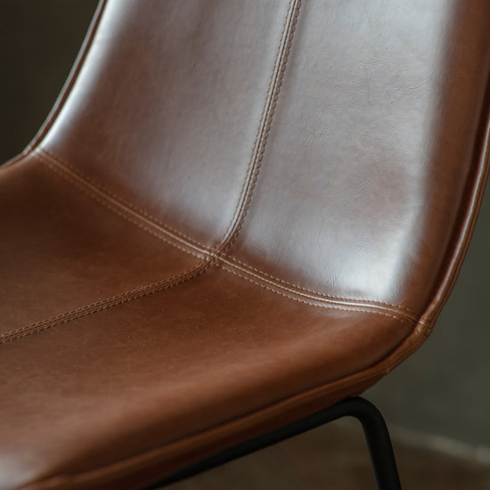 A close up of a Slapton Stool Brown (2pk) 480x550x975mm dining chair, an interior decor item from Kikiathome.co.uk.