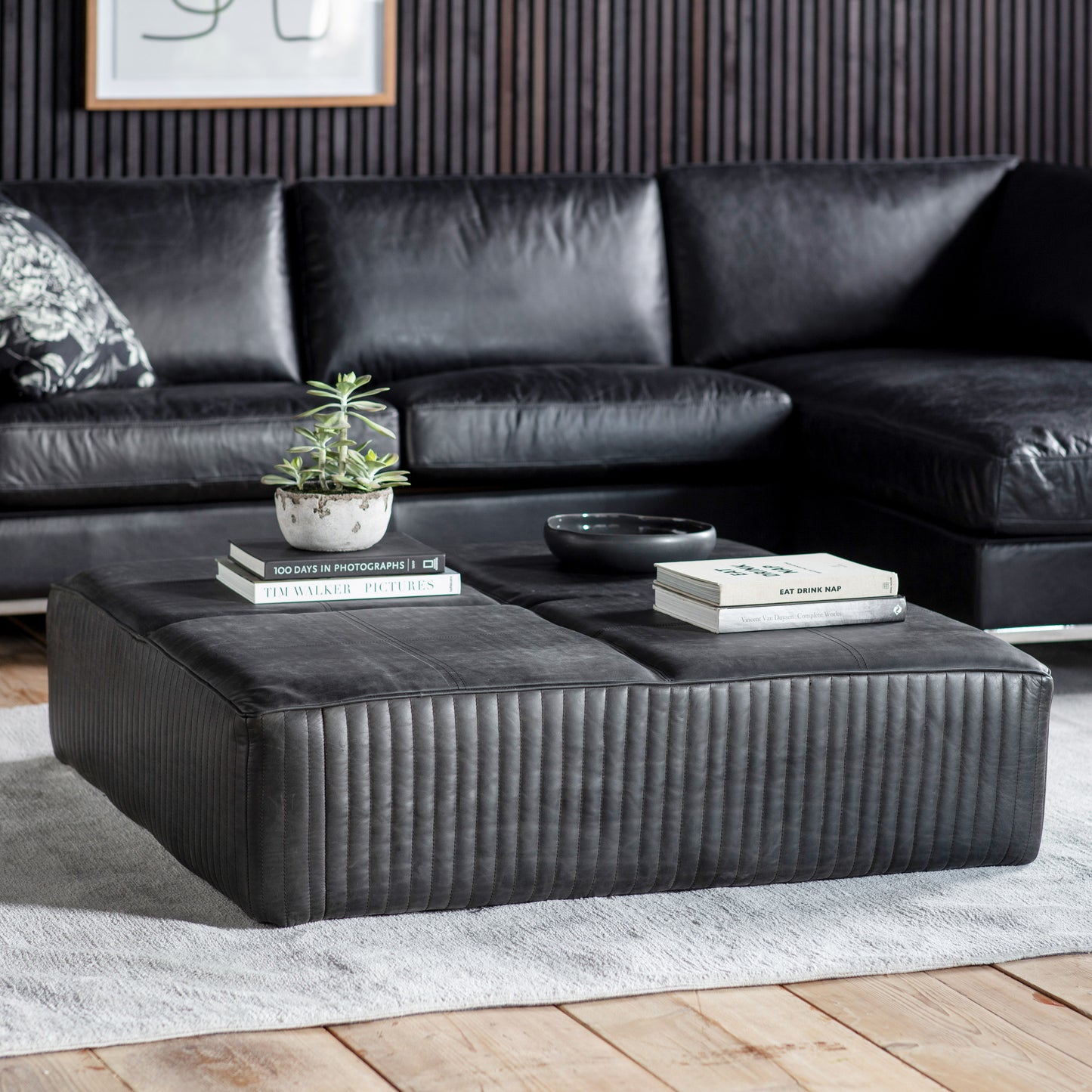 A Cornwood Slab Black Leather 1200x1200x300mm coffee table from Kikiathome.co.uk adds a touch of interior decor to any living room.