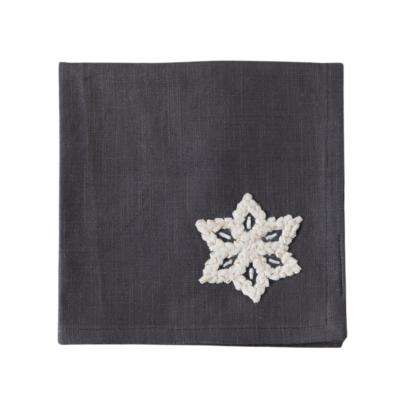 A Brist Snowflakes Napkin Charcoal 450x450mm (4pk) with white snowflake on it, perfect for interior decor.