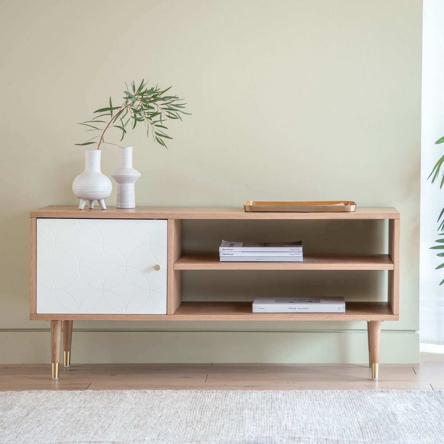 A stylish interior decor piece for your home with a plant on top – the Newbury Media Unit Oak White from Kikiathome.co.uk.
