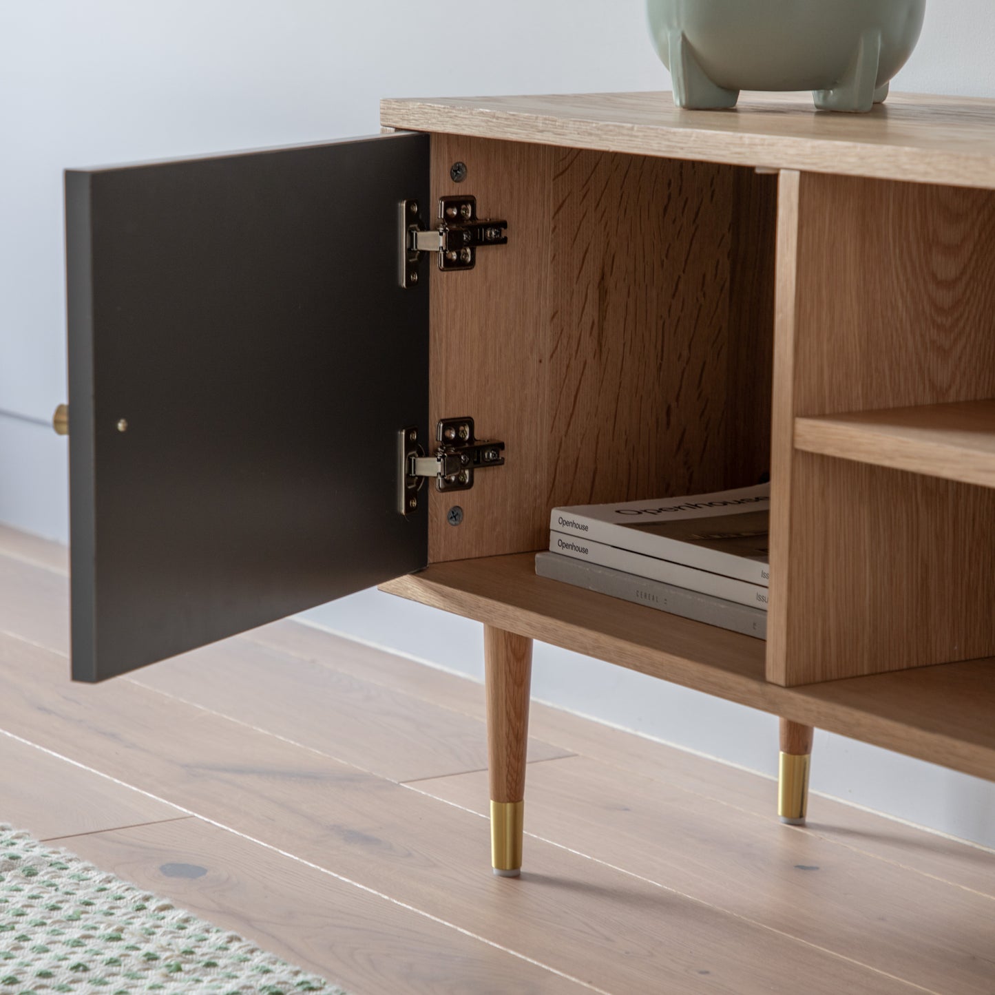 A stylish interior decor piece, the Kikiathome.co.uk Newbury Media Unit Oak Grey 1200x400x550mm features an open door and is perfect for home furniture.