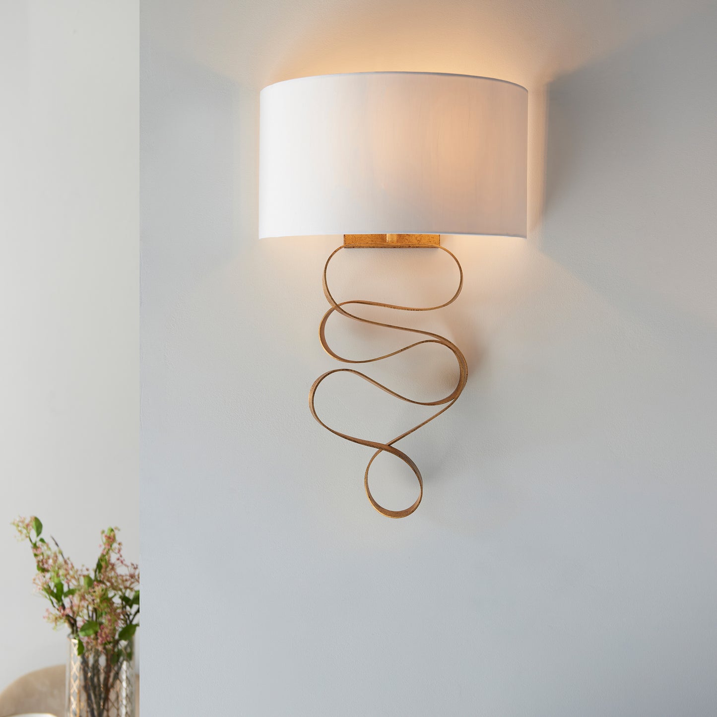 A Godfrey Wall Light Gold with a white shade, perfect for interior decor.