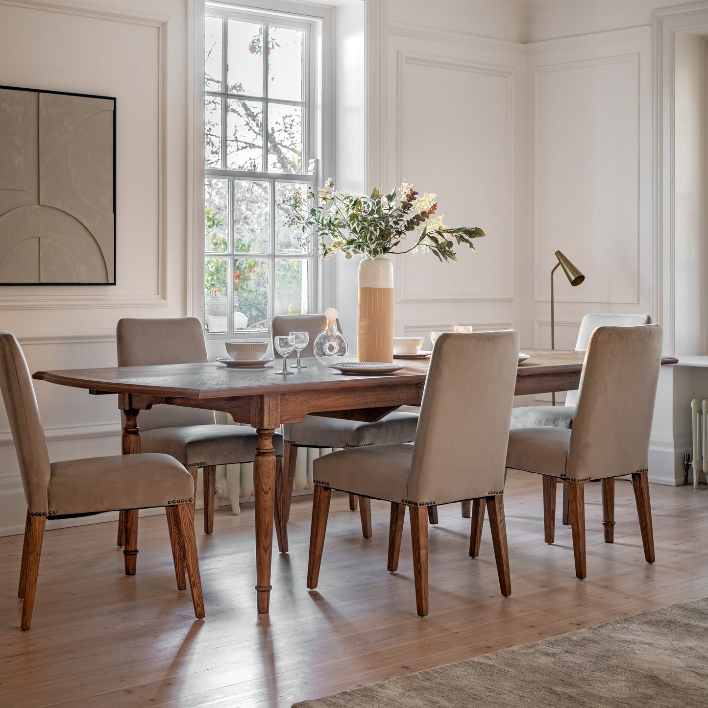 A dining room furnished with stylish home furniture from Kikiathome.co.uk, including the Sweaton Extending Dining Table and chairs.