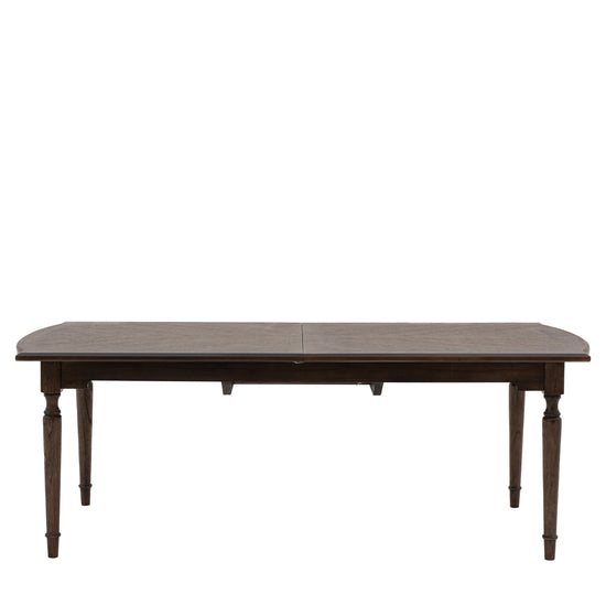A Manaton Extending Dining Table with a wooden top for home furniture.