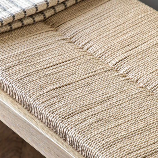 A Buckland Oak and Rope Hallway Bench with woven blanket for interior decor.