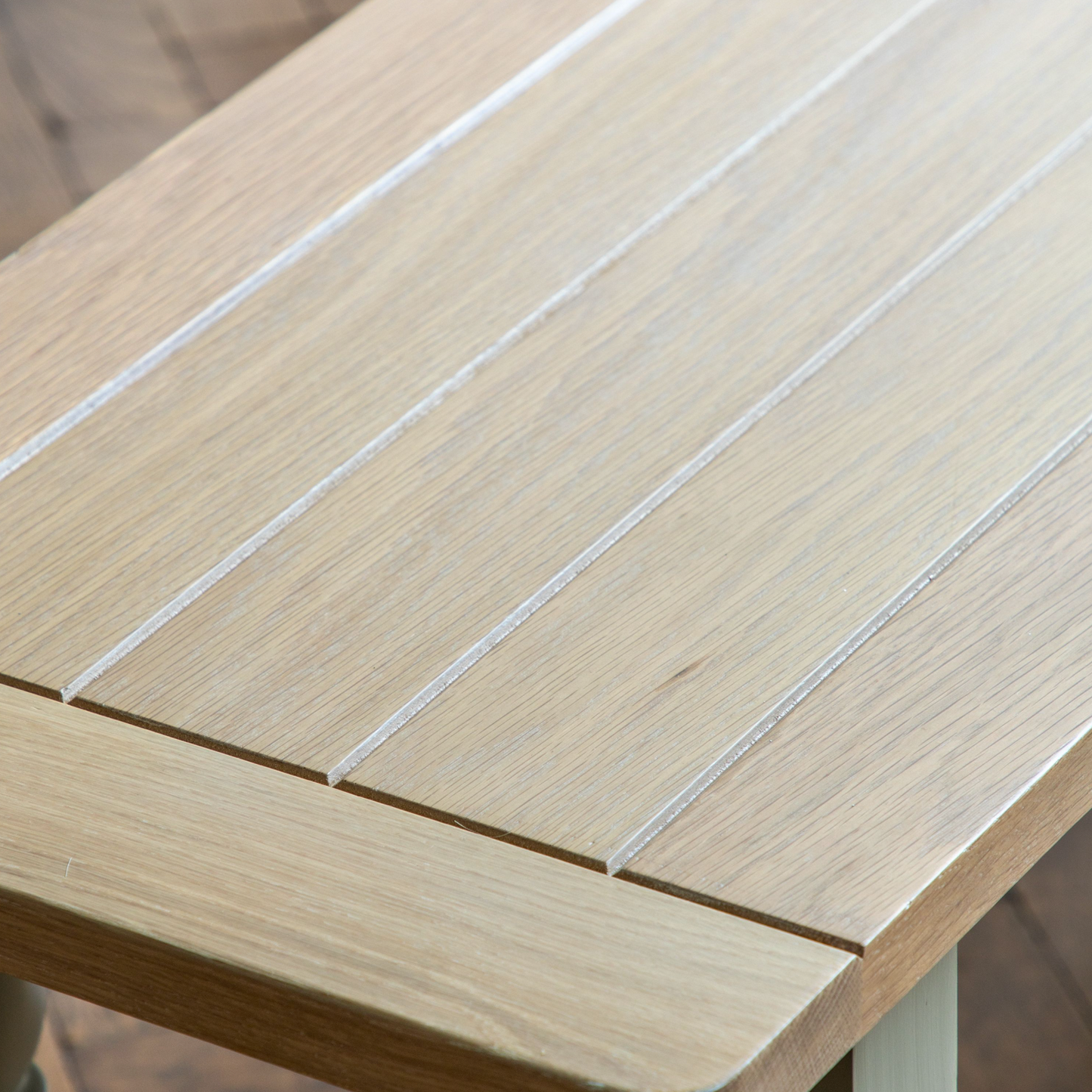 A close up of a Buckland Dining Bench 1500x380x450mm in Meteor by Kikiathome.co.uk on a wooden floor, perfect for interior decor and home furniture.