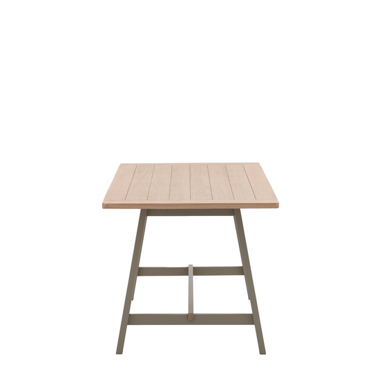 A Prairie-themed Buckland Trestle Table with a wooden top and metal legs, perfect for home furniture and interior decor.