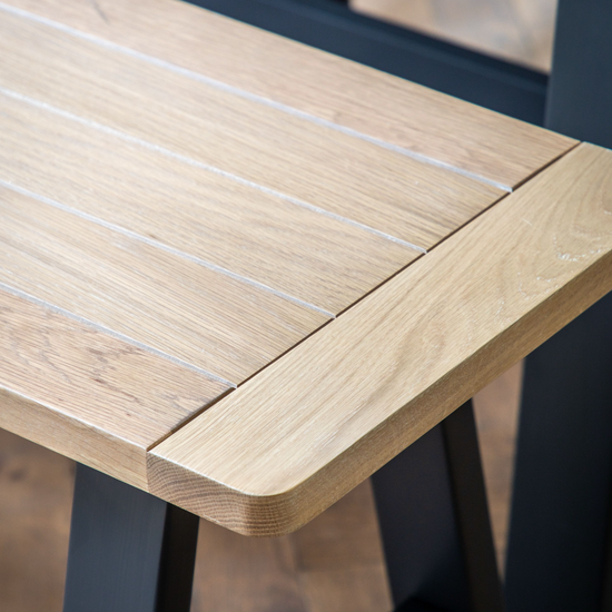 A close up of a Buckland Trestle Bench in Meteor by Kikiathome.co.uk, a stylish addition to home furniture and interior decor.