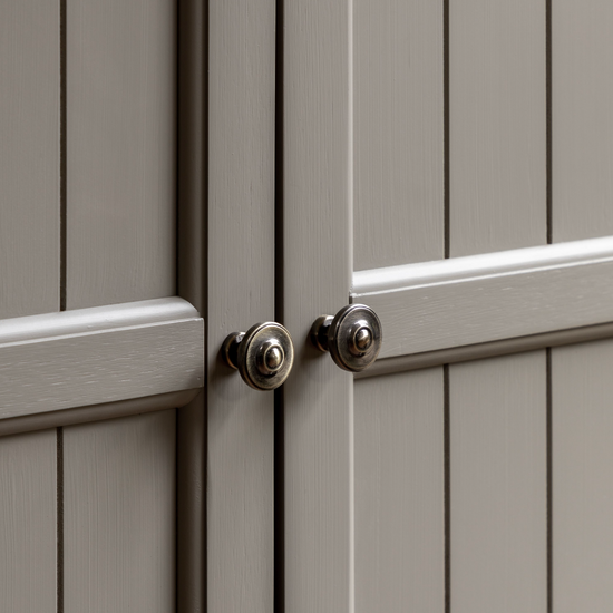 A close up of an interior decor Buckland 2 Door Storage Cupboard in Prairie from Kikiathome.co.uk with a knob on it.