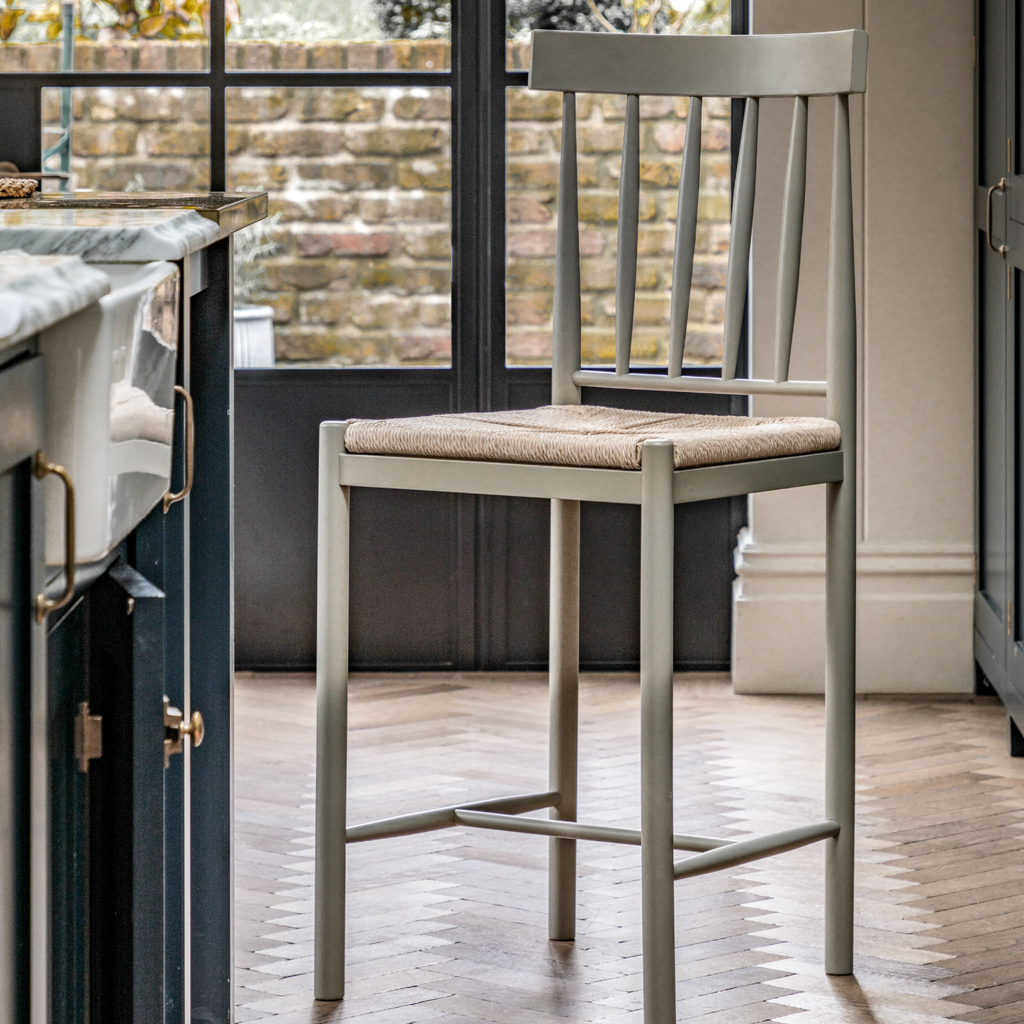 A kitchen featuring Buckland Bar Stools in Prairie 2pk, complementing the interior decor of the home furniture.