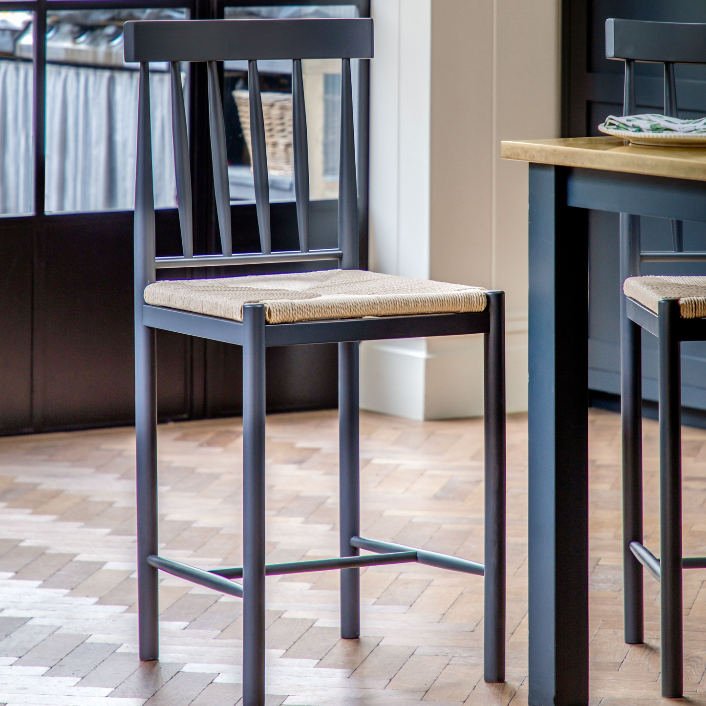 A Buckland Bar Stool in Meteor 2pk by Kikiathome.co.uk wooden table and chairs in a kitchen.
