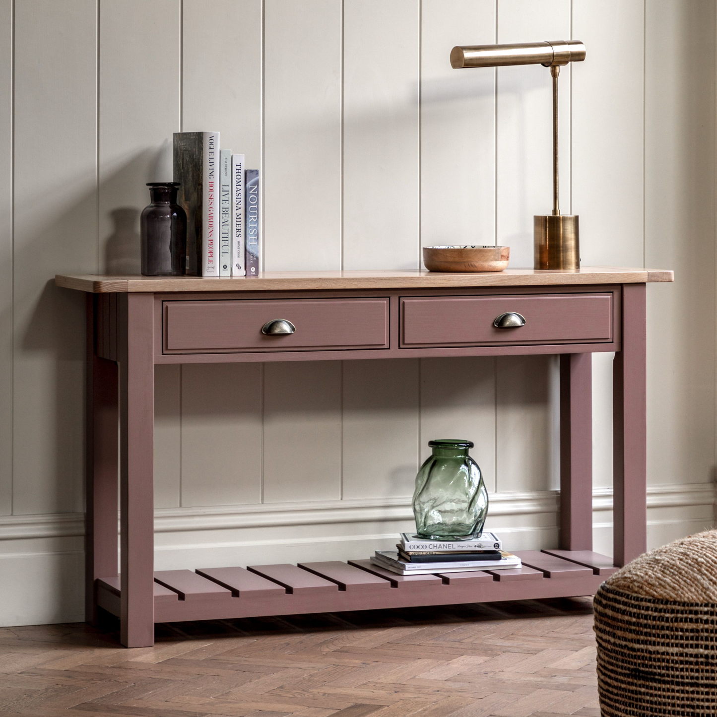 A Buckland Console Table with drawers and a lamp for home furniture and interior decor.
