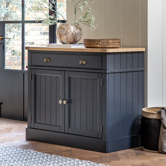 A Buckland 2 Door 1 Drawer Sideboard in Meteor, a home furniture piece for interior decor in a living room.