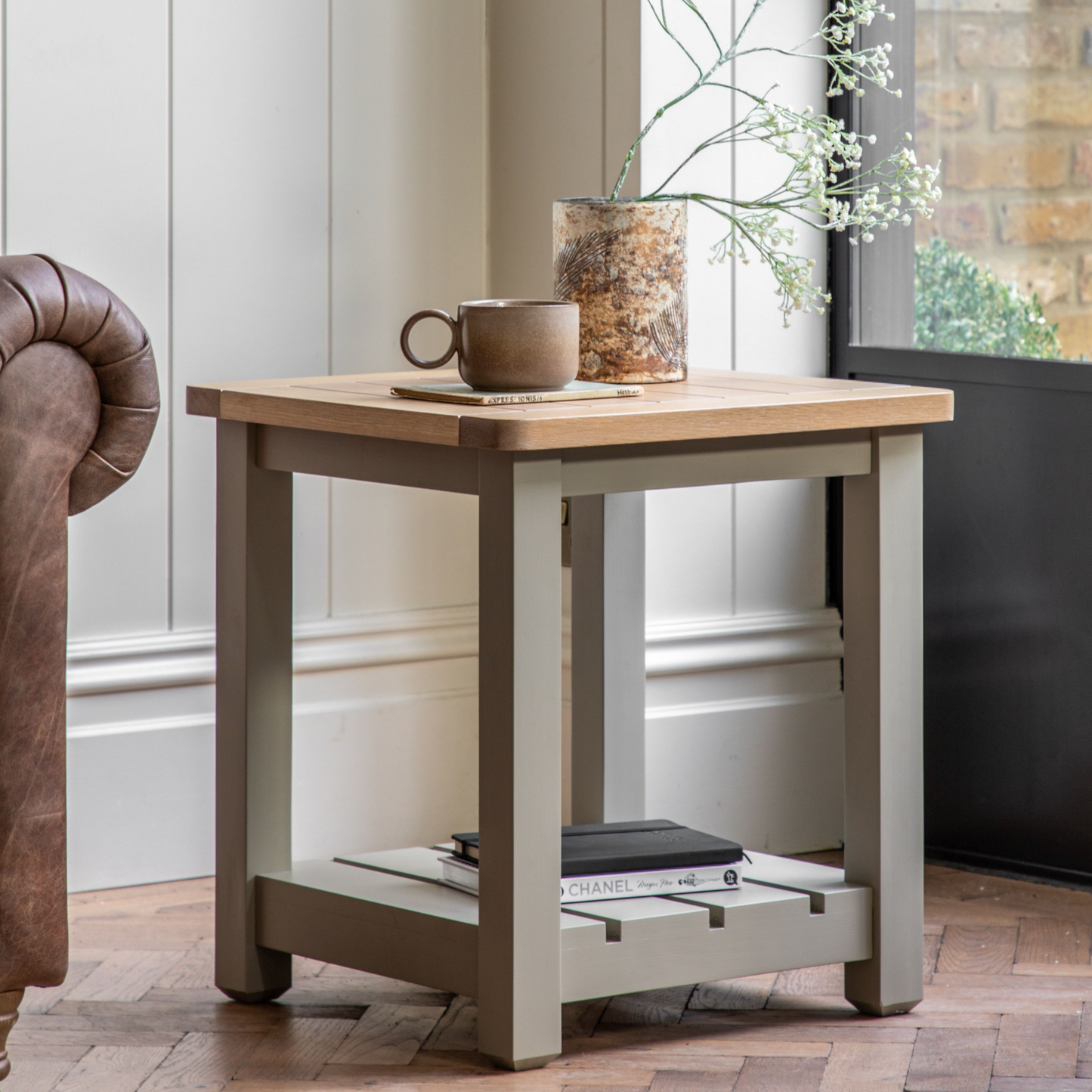 A Buckland Side Table in Prairie from Kikiathome.co.uk with a book and a cup of coffee, perfect for interior decor and home furniture.