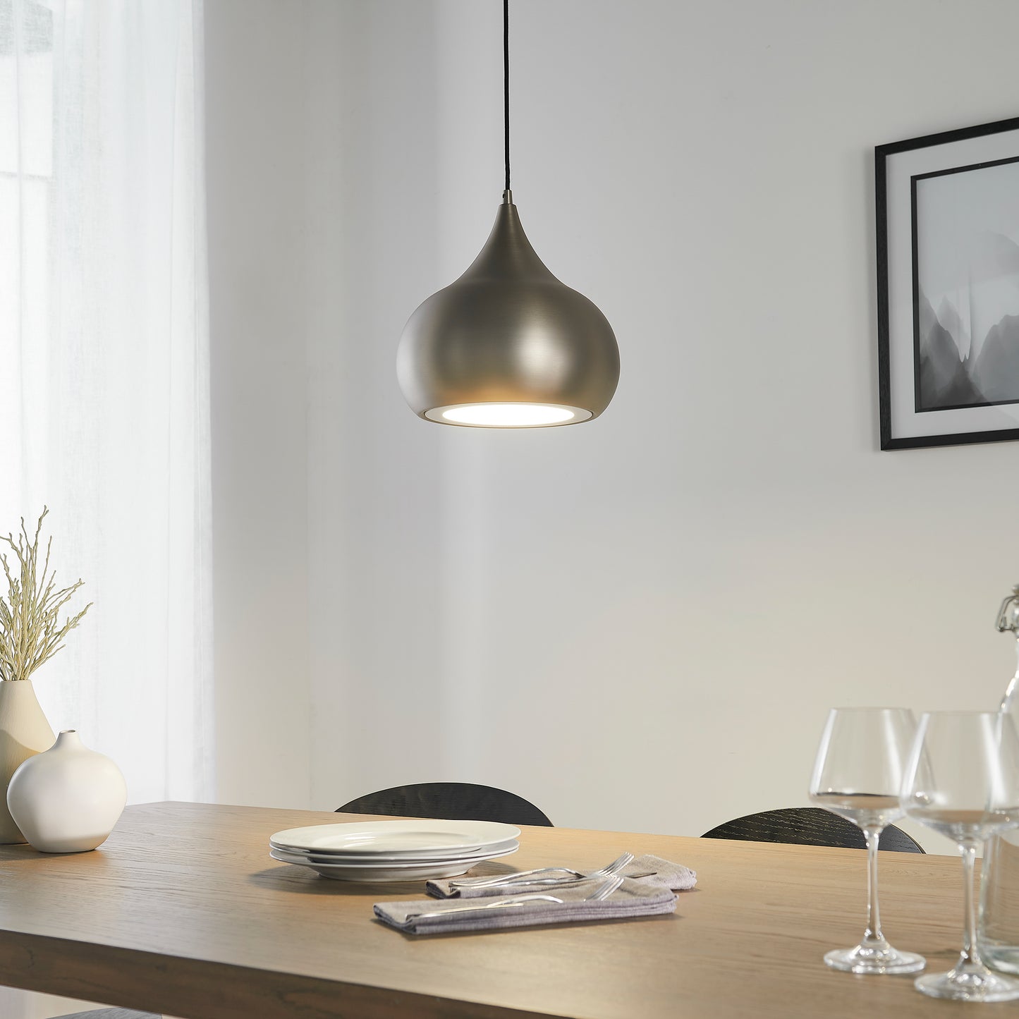 A dining room with interior decor and home furniture, including a table and chairs and a Brosser Pendant Light by Kikiathome.co.uk.