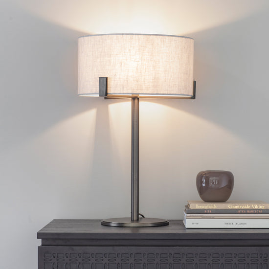 A Hayfield Table Lamp Bronze/Natural from Kikiathome.co.uk as interior decor on a dresser.