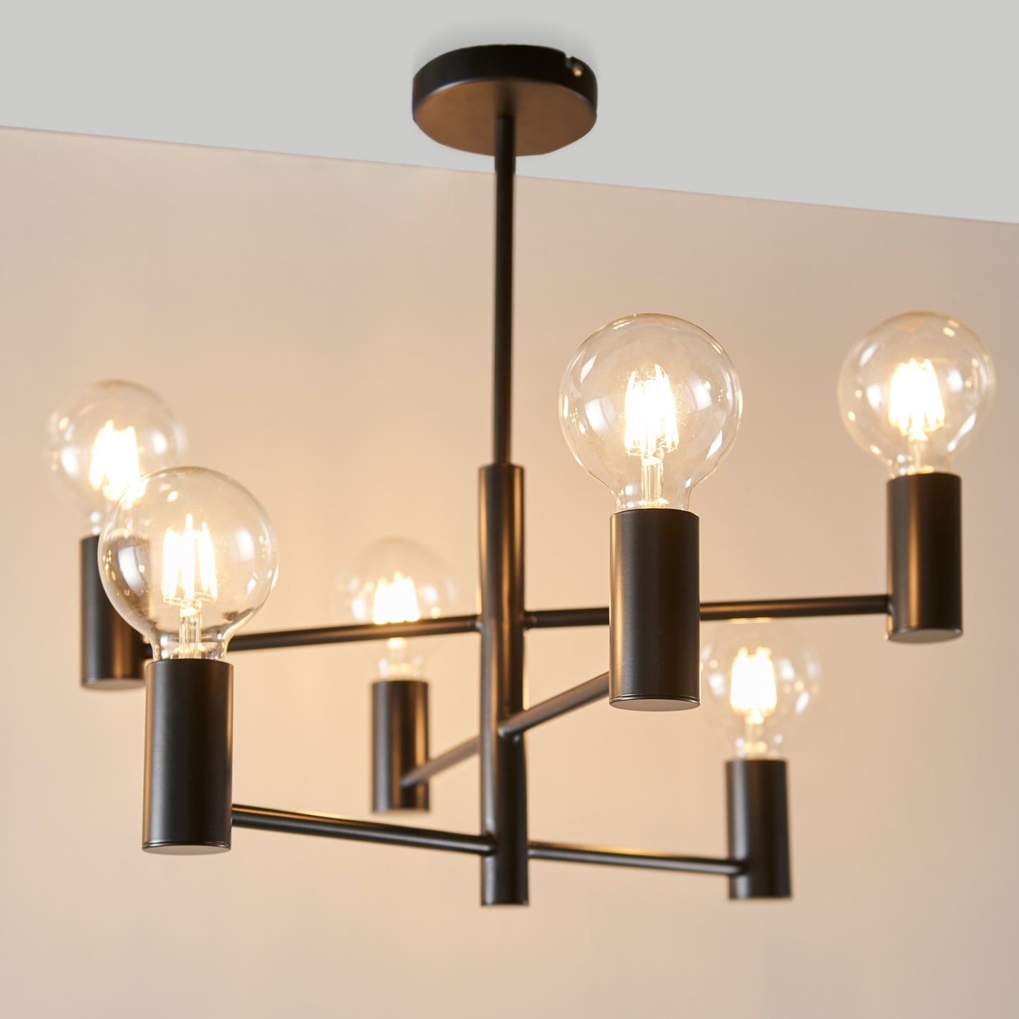 A Studio 6 Ceiling Light 553mm with five light bulbs for interior decor.