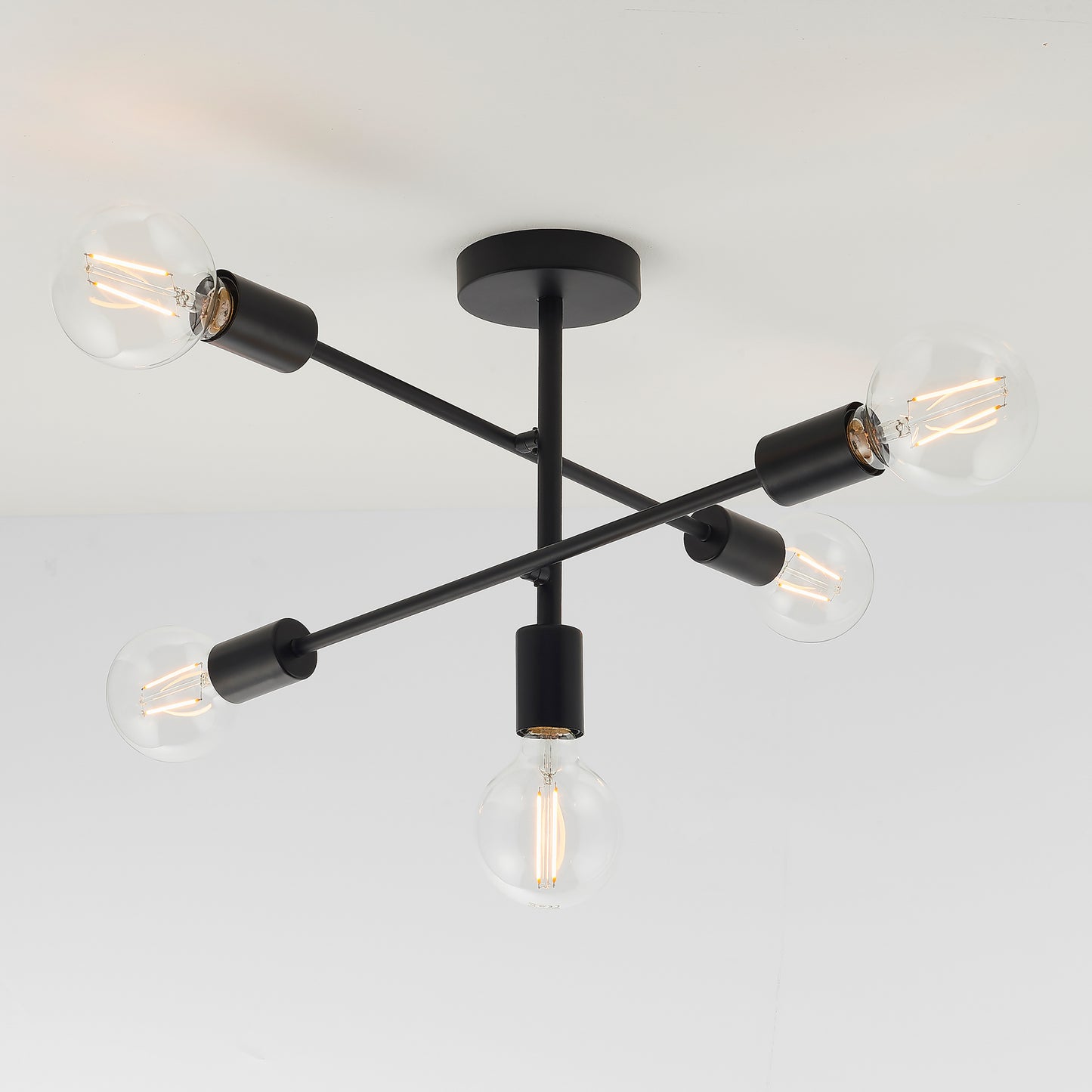 A Studio 5 Ceiling Lamp Black with four bulbs for home interior décor.