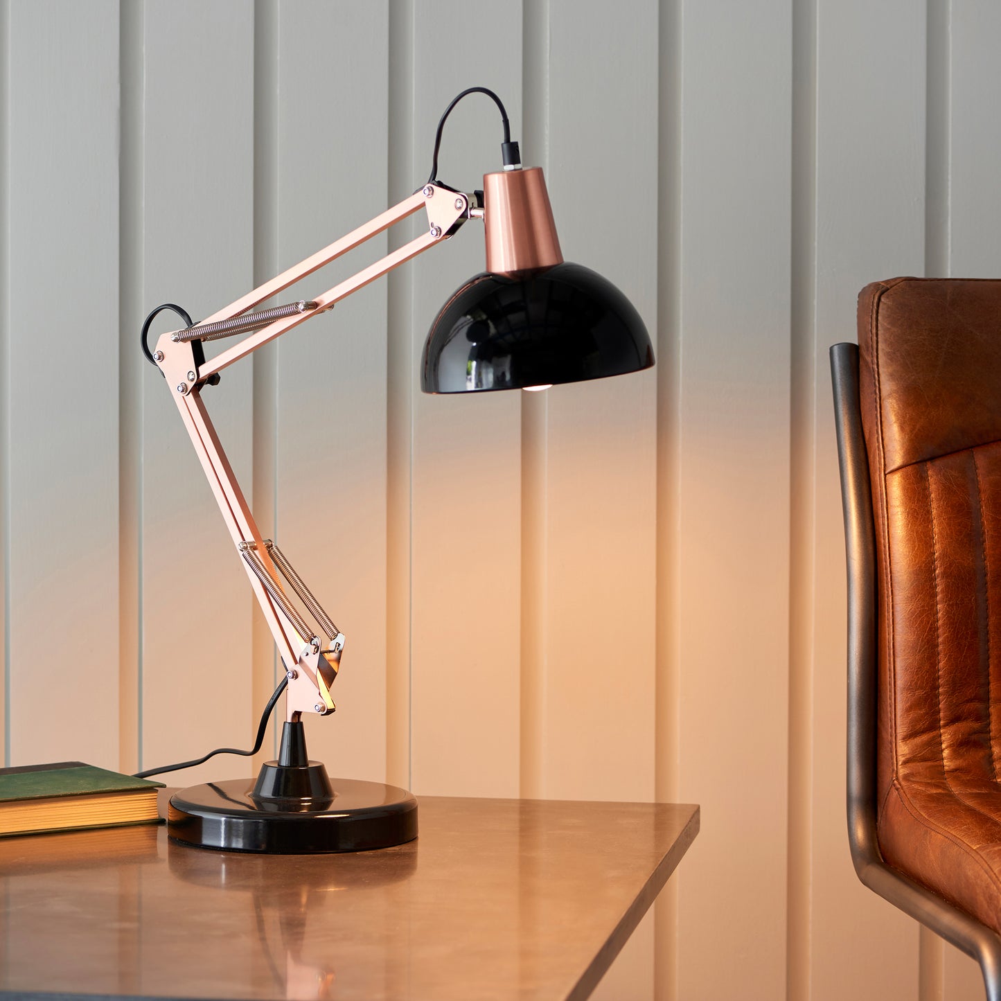 A Marshall 1 Table Light Bronze & Black by Kikiathome.co.uk featuring interior decor and home furniture elements like a leather chair and a book.