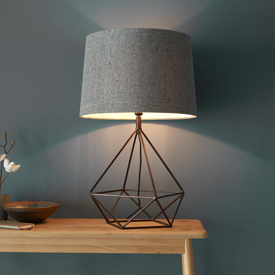 Load image into Gallery viewer, A Bow 1 Table Light with a grey shade on a wooden table for home decor from Kikiathome.co.uk.
