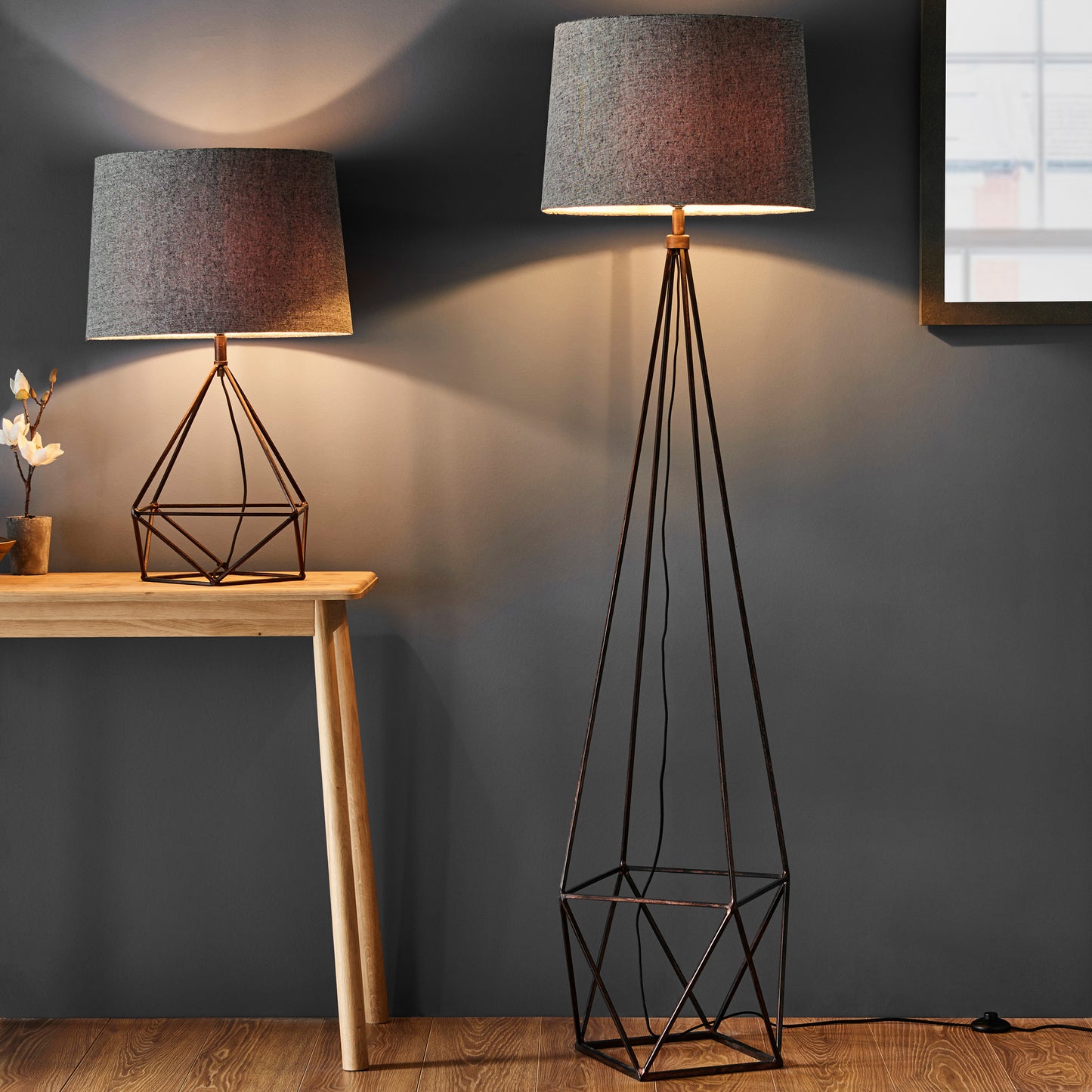 A geometric floor lamp and two Bow 1 Table Lights from Kikiathome.co.uk showcasing interior decor on a table.