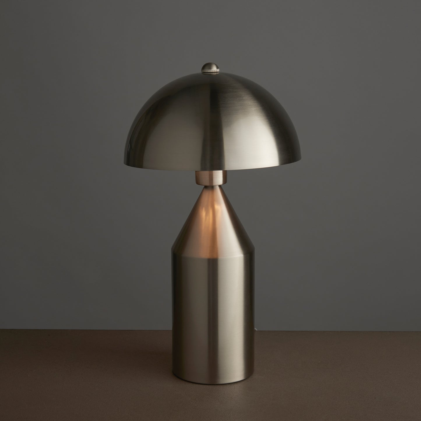 A Nova Table Lamp with a dome on top, perfect for interior decor and home furniture.