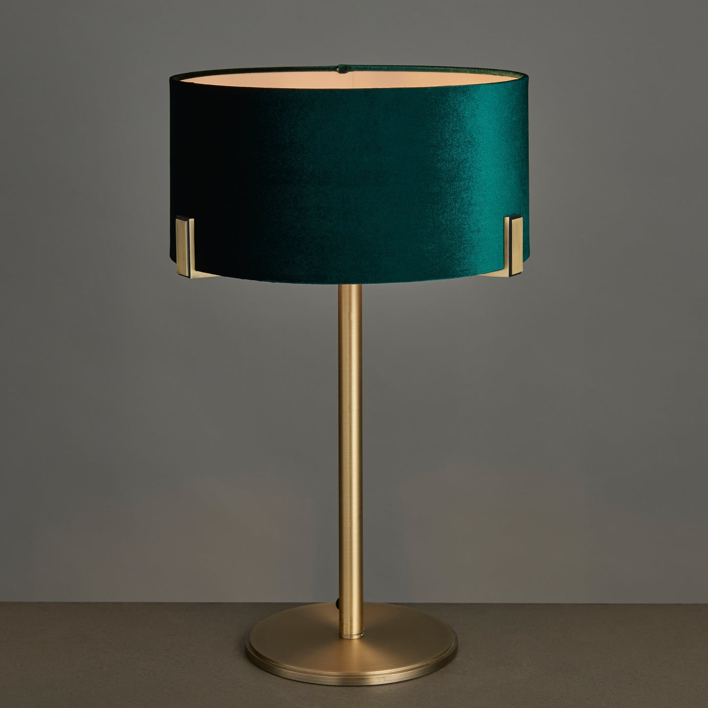 Hayfield Table Lamp Antique Brass with an emerald green shade for home interior decor.