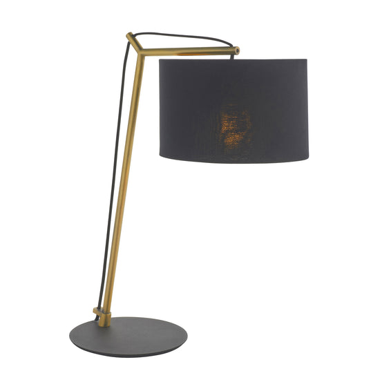 A Buckland Table Lamp Antique Brass with a black shade for interior decor.