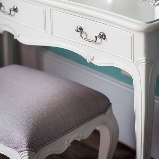 A Kikiathome.co.uk dressing table, perfect for interior decor, in vanilla white with a matching stool.