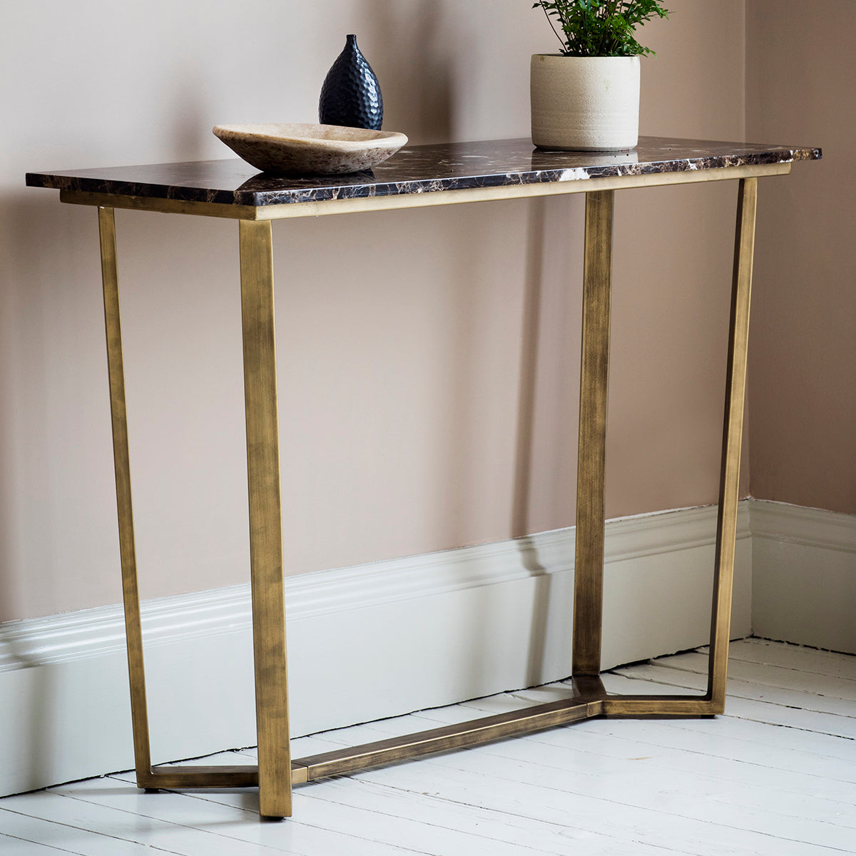 A Moreleigh Console Table Marble with a gold frame and marble top, perfect for home furniture and interior decor.