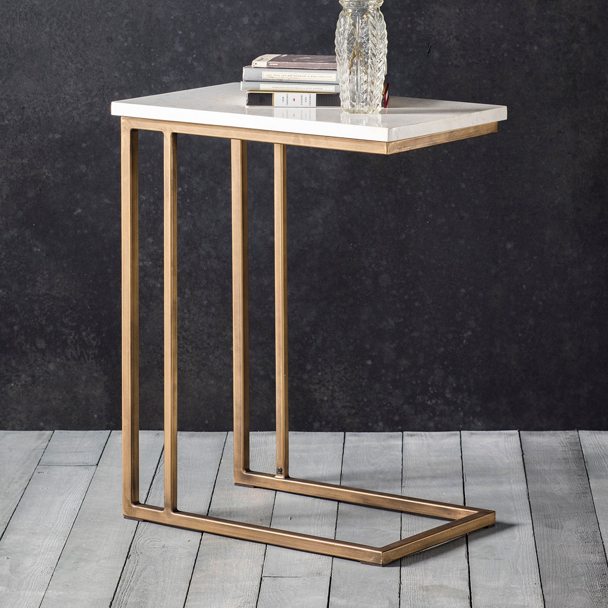 An elegant Hallsand Supper Table Marble with a gold frame and marble top, perfect for home furniture and interior decor.