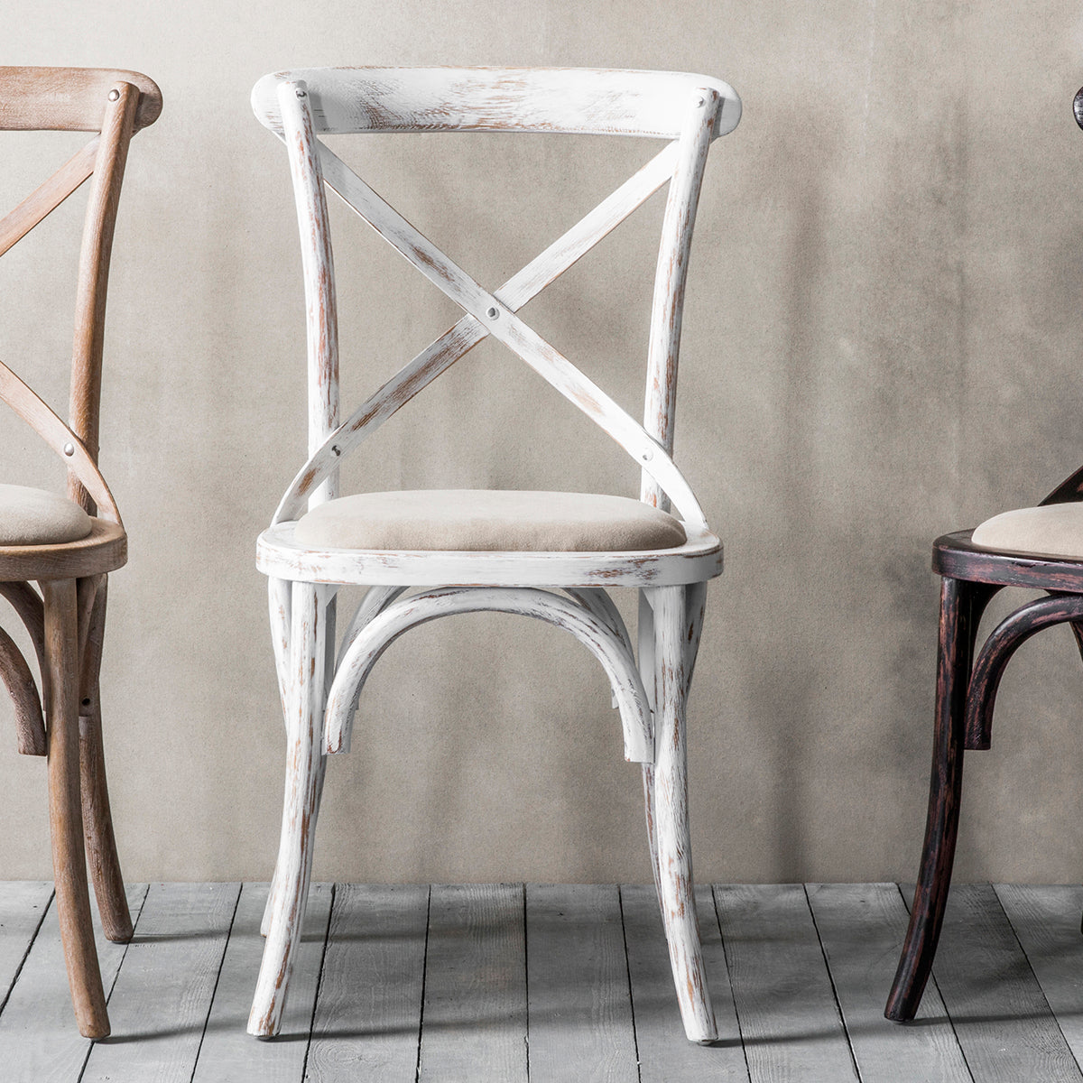 Three cafe chairs from Kikiathome.co.uk are lined up against a wall, adding to the interior decor of the space.