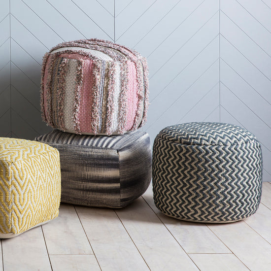 Load image into Gallery viewer, Three Tivoli Pouffe Grey from Kikiathome.co.uk sitting on a wooden floor.
