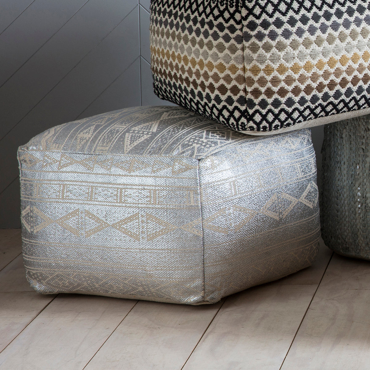 A pair of Metallica Pouffe Silver by Kikiathome.co.uk stacked, perfect for home furniture and interior decor.