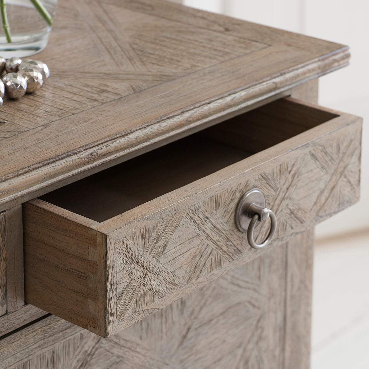 Load image into Gallery viewer, An image of a Belsford 7 Drawer Chest 1300x450x885mm with a flower on it, available at Kikiathome.co.uk for home furniture or interior decor.

