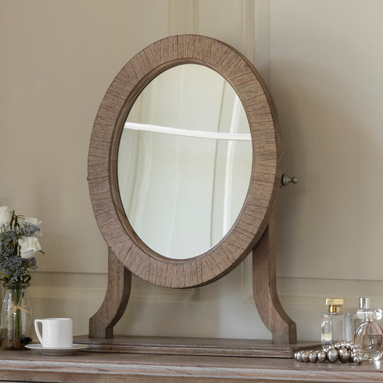 A Kikiathome.co.uk Belsford Dressing Table Mirror enhances interior decor when placed on a dresser.