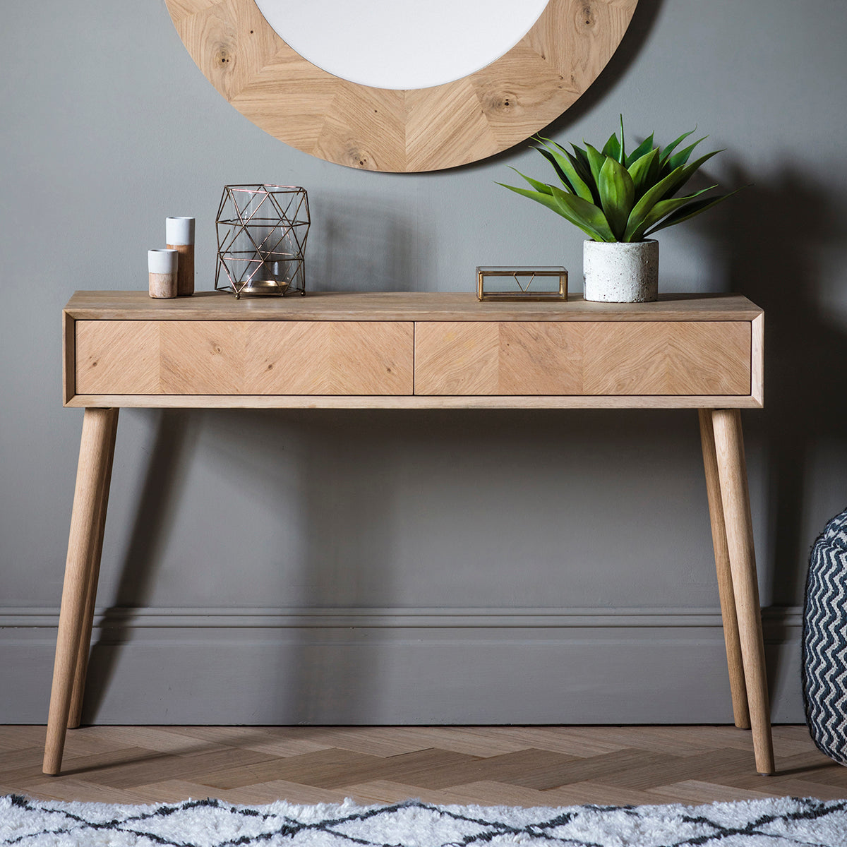 A Tristford 2 Drawer Console Table with mirror for interior decor and home furniture.