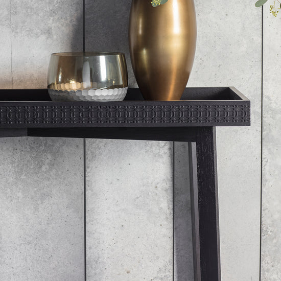 A Dartington Boutique Console Table 1100x400x800mm from Kikiathome.co.uk adorned with a vase, perfect for interior decor and home furniture.