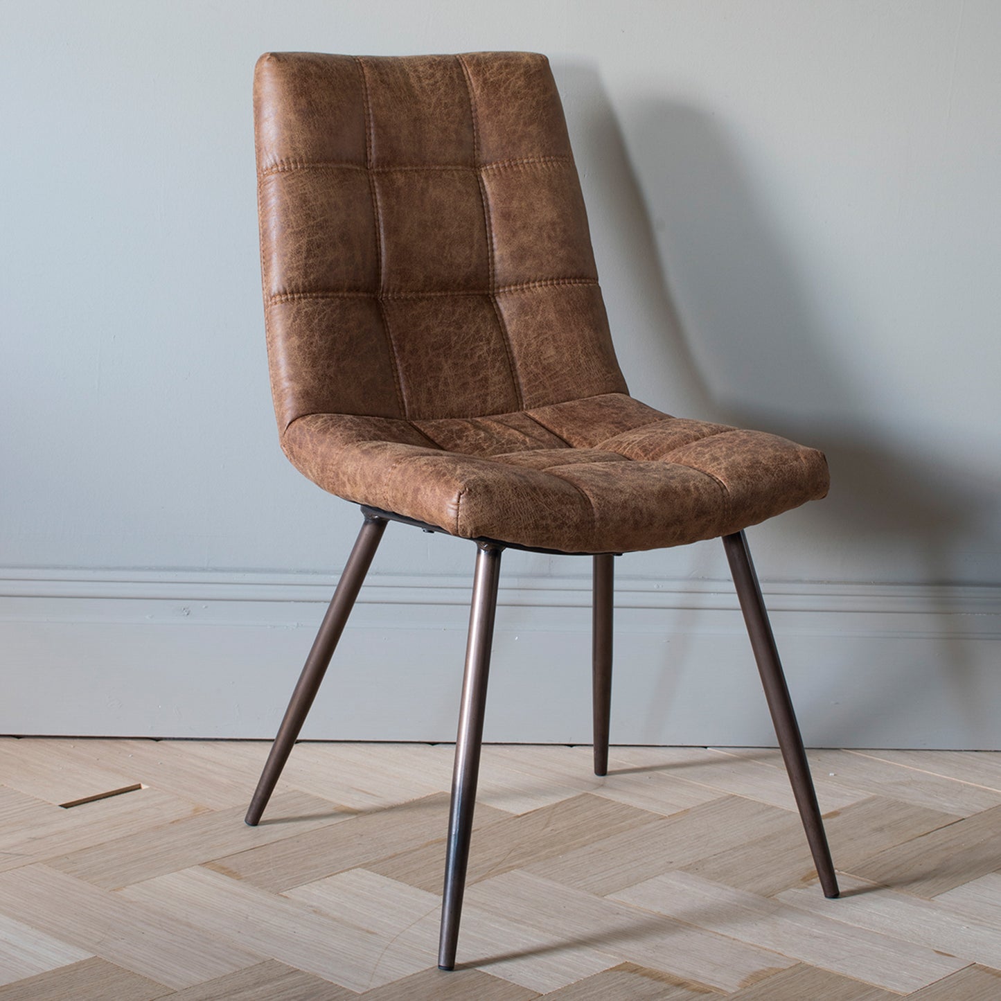 Interior decor, Home furniture: A stylish Darwin Brown Chair (2pk) from Kikiathome.co.uk enhances interior decor on a wooden floor.