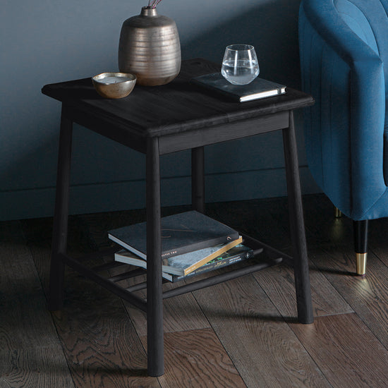 A Tigley Side Table Black by Kikiathome.co.uk completes the interior decor of a home with its sleek design.